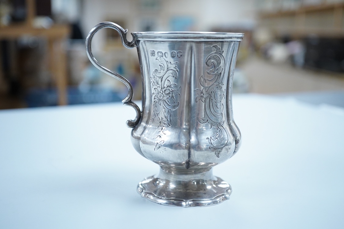 A Victorian engraved silver christening mug, on a pedestal foot, by Daniel & Charles Houle, London, 1848, 97mm, 4.4oz.